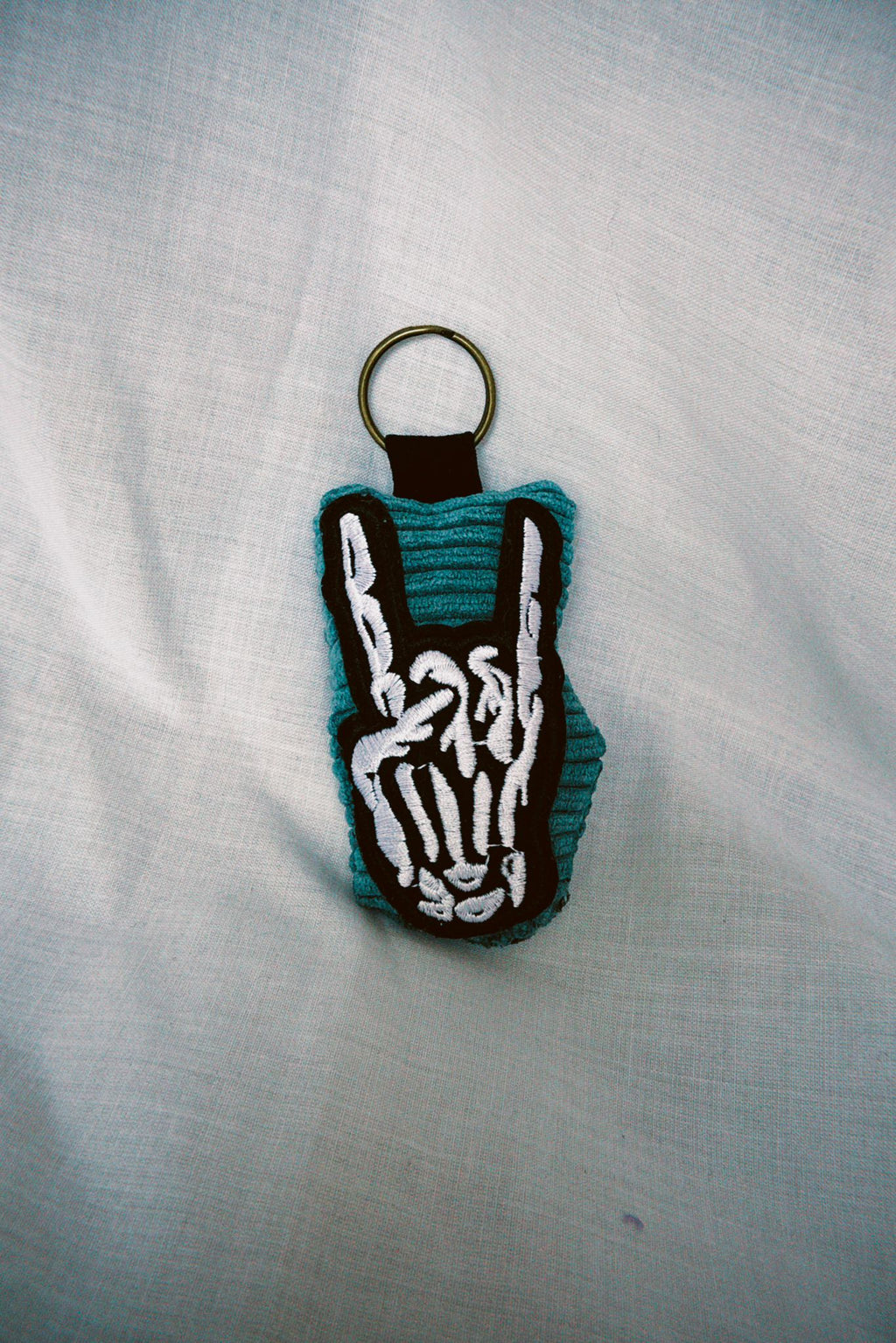 Skeletal Rock Hands Scrappy Keyring